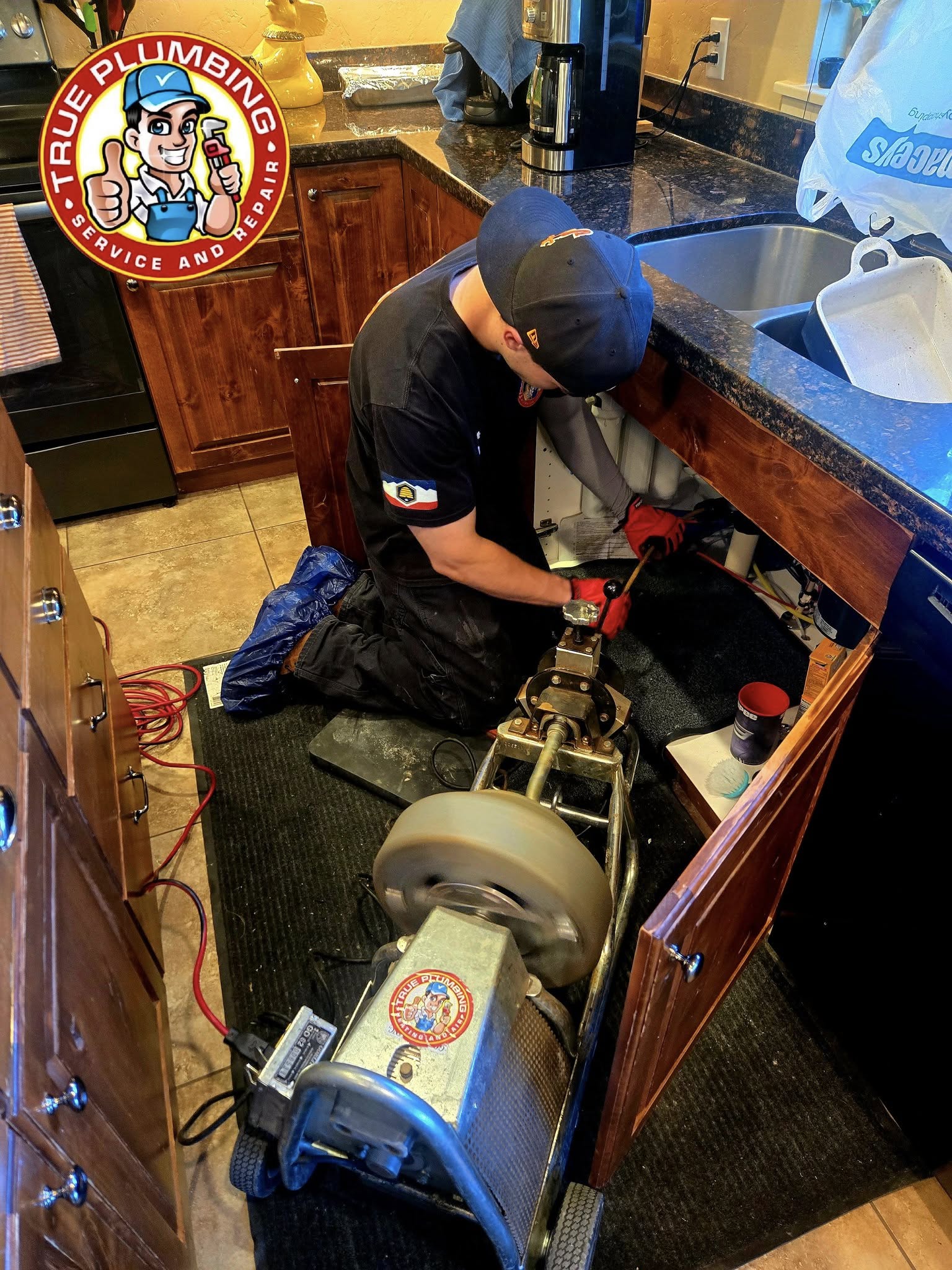 Plumber performing professional drain cleaning to clear clogged drain and restore proper plumbing flow
