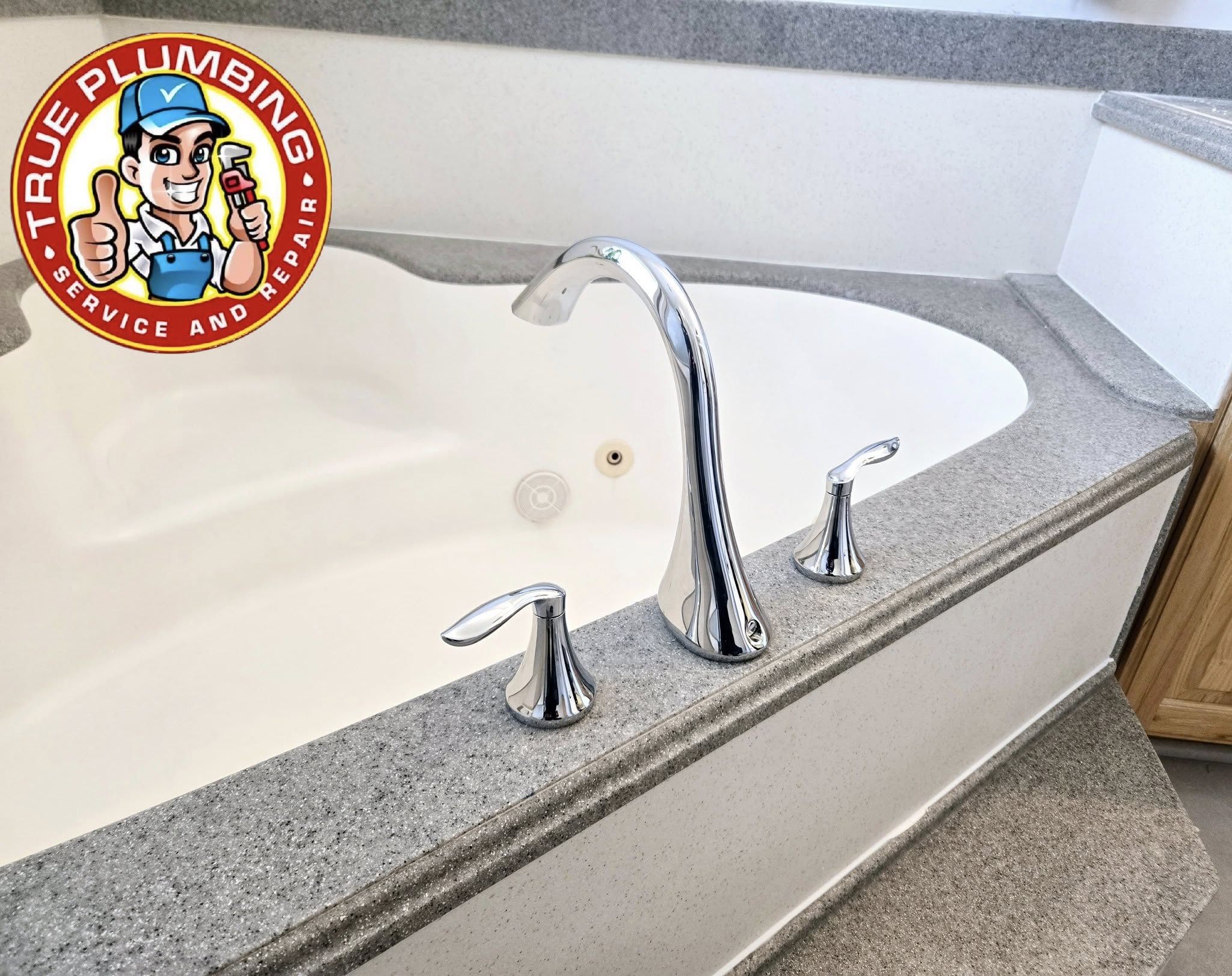 Plumber replacing bathtub faucet and installing new tub spout fixture to restore proper water flow