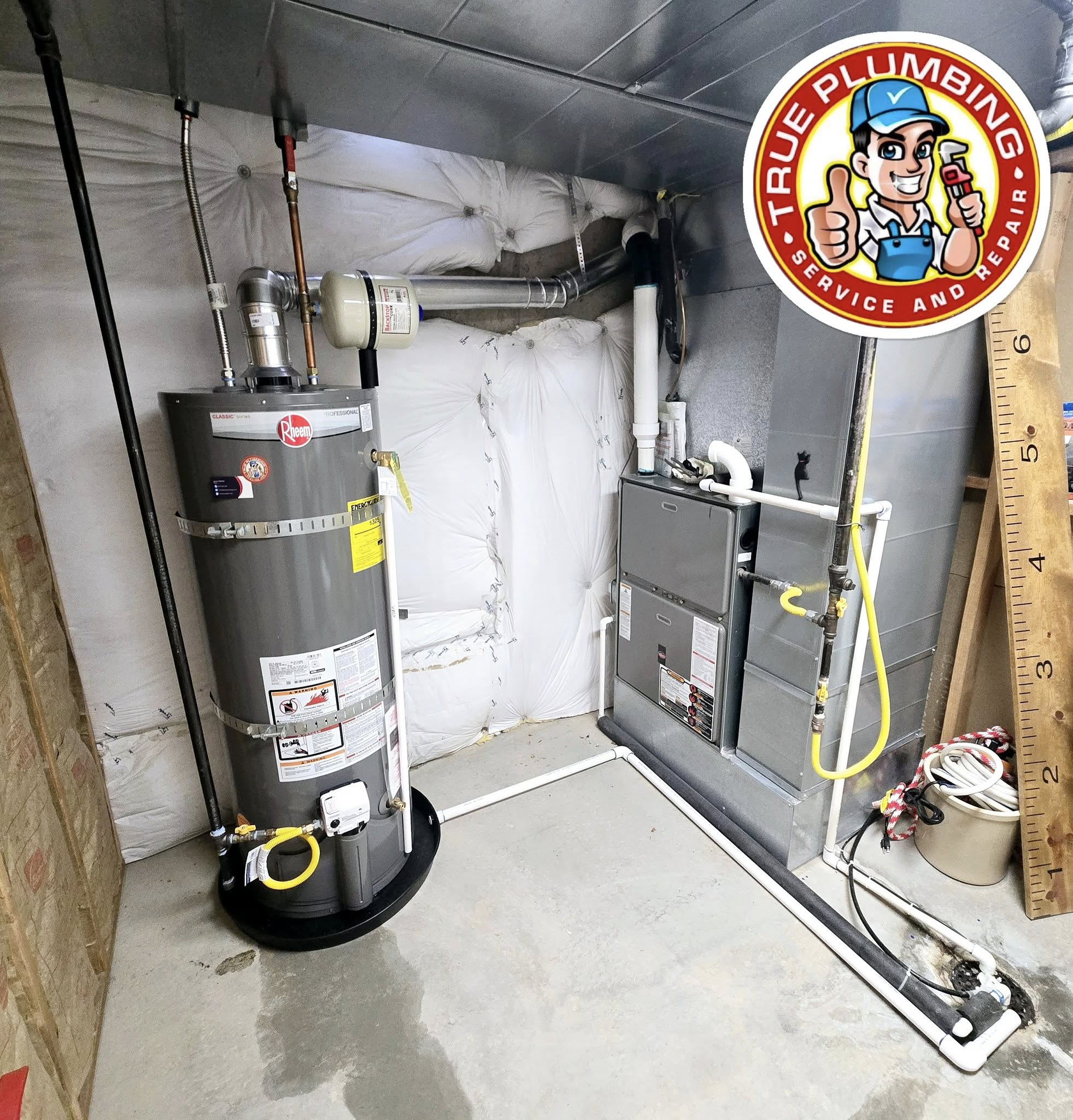Plumber servicing residential water heater performing installation repair and maintenance for reliable hot water